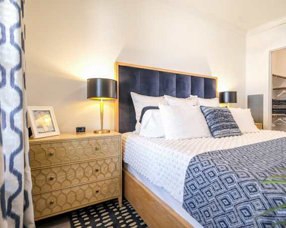 spacious bedroom at Reveal on the Lake luxury apartments in Rowlett, TX