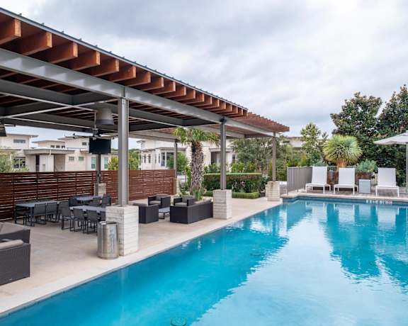 the swimming pool and outdoor lounging areas at Berkshire Santal apartments