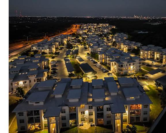 an aerial night-time view of Berkshire Santal apartments in Austin, TX
