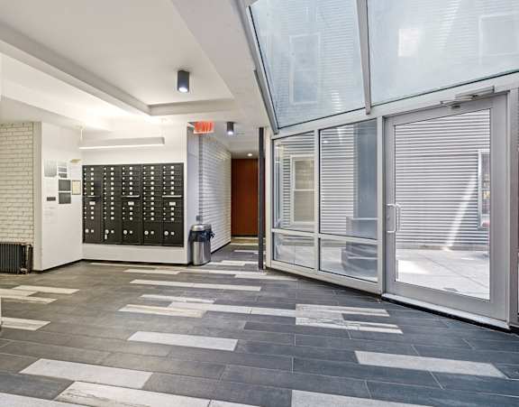 A hallway with a black and white checkered floor.