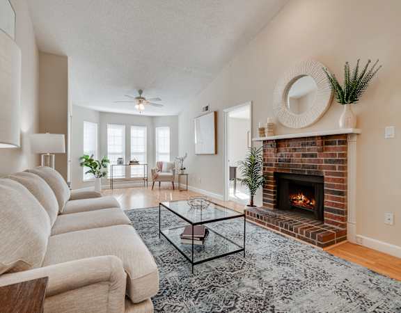 Living Room With Fireplace & Bay Windows