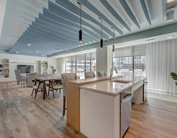a kitchen with an island and a dining table