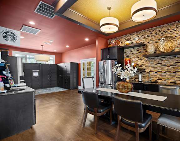 A modern kitchen with a dining table and chairs.