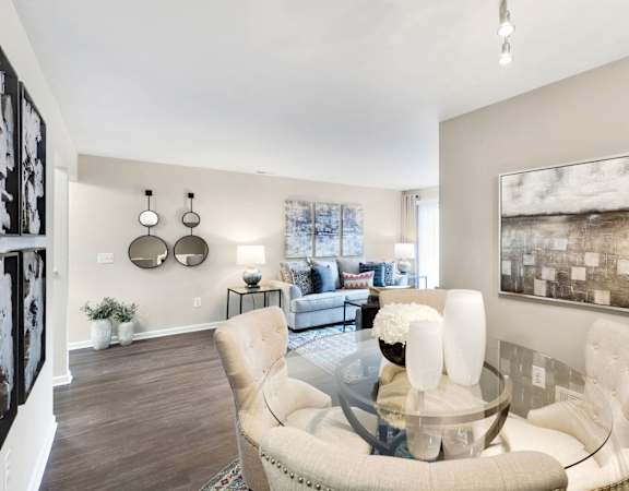 an open living room with a glass table at Northridge, Rochester Hills, Michigan