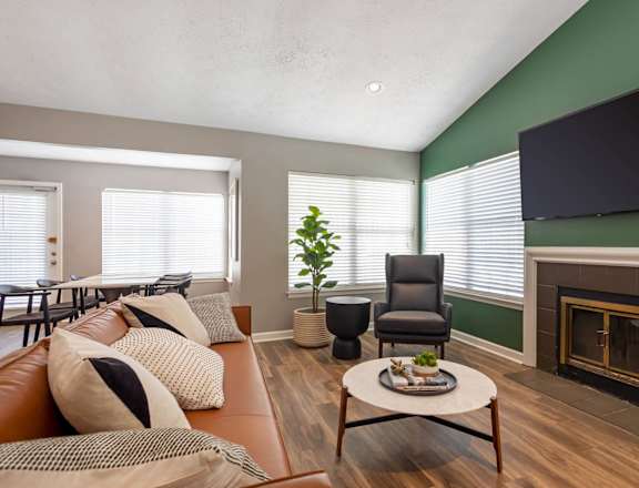 a living room with a couch and a fireplace at The Annaline, Nashville, Tennessee