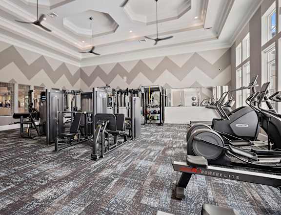 A gym with a variety of equipment including treadmills, weights, and exercise machines at Ellis Station, Durham, North Carolina, 27703
