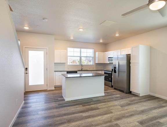 Kitchen and living room at Brownstones at Palisade Park, Broomfield, 80023