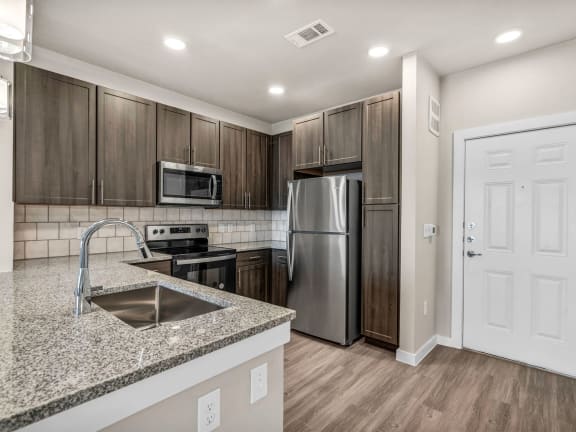 a kitchen with a stove and a microwave