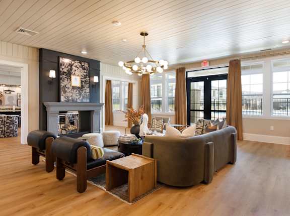 A living room with a fireplace and a chandelier.