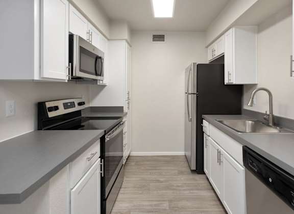 apartment kitchen with stainless steel appliances at Paseo 51, Glendale, 85302