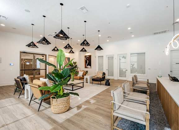 A modern office space with wooden floors and furniture.