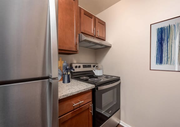 a kitchen with a table and chairs and a window