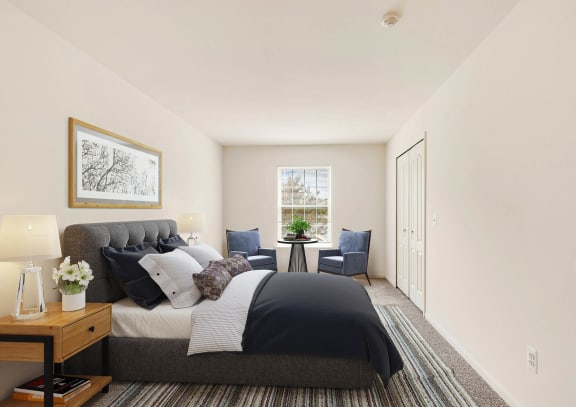 a bedroom with a bed and a chair in a room at Wyndchase, MI 48147