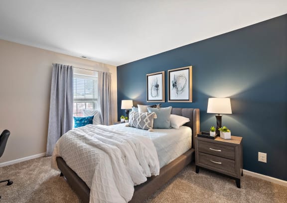 a bedroom with a bed and a window at Northridge, Rochester Hills, 48307