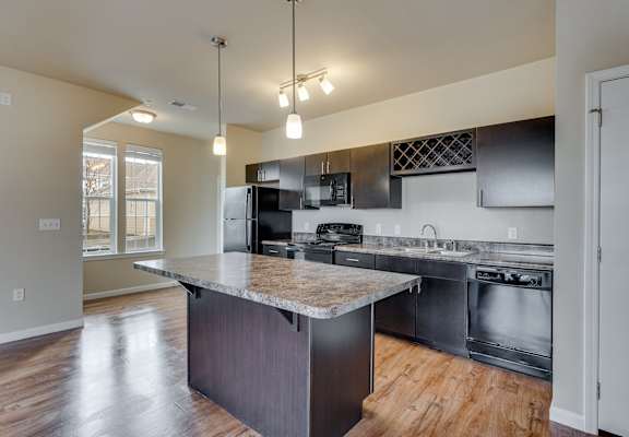 Fully-Equipped Kitchen With Large Windows