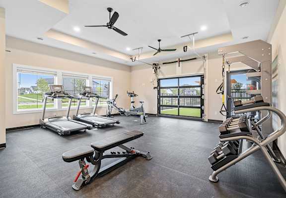 a gym with treadmills and other exercise equipment