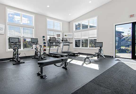 the gym at the enclave at woodbridge apartments in sugar land, tx