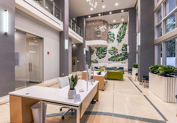 a large lobby with a table and chairs at Paramount on Lake Eola, Orlando, FL