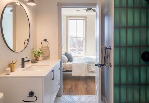 a bathroom with a sink and a mirror at The Nicholas, St Louis, Missouri 63104