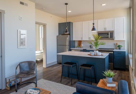 a kitchen and living room at The Nicholas, St Louis, MO