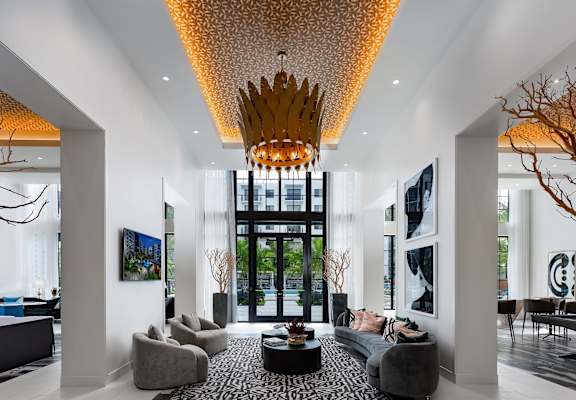 a rendering of a living room with white walls and a large golden chandelier