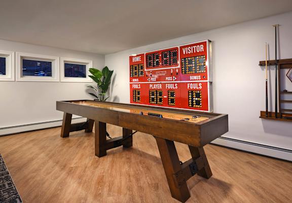 Game Room With Shuffle Board at Heritage at the River, Manchester, 03102