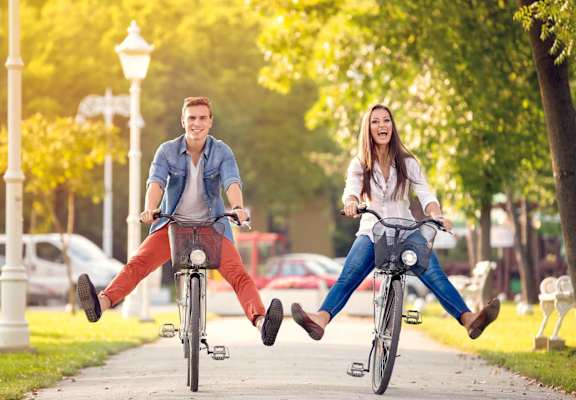 Couple Riding Bikes at University Village Apartments, Colorado Springs, CO 80918