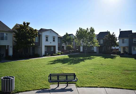 Dixieanne/Victory Mutual Housing lawn and bench