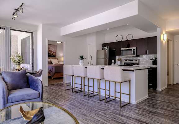 spacious, open-concept kitchen and living room at Avora apartments