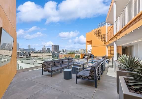 rooftop patio with comfortable seating at One Santa Fe apartments