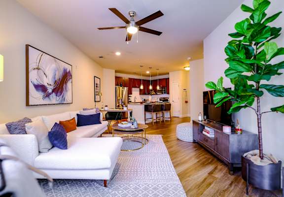 Berkshire Village District apartments living room with hardwood-inspired flooring
