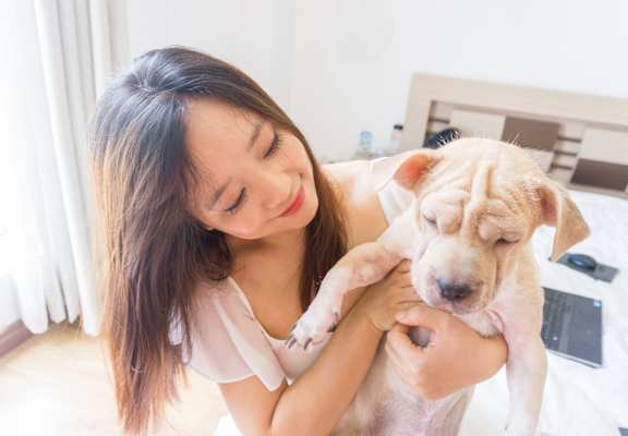 woman holding a dog