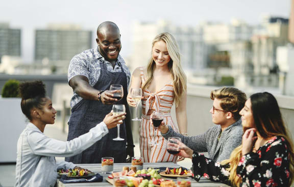 Friends having barbeque outdoors  at 1200 Lakeshore, Oakland, CA
