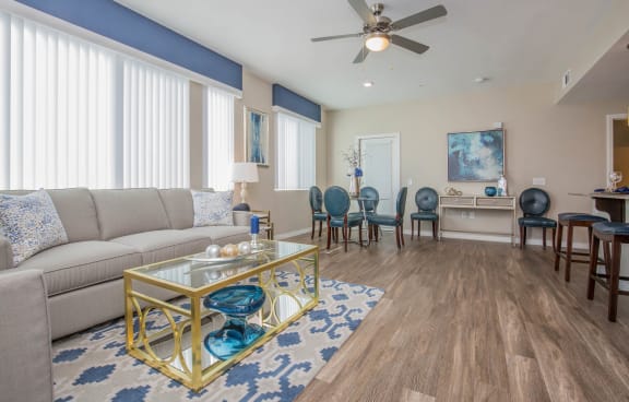 Living Room With Dining Area at The Passage Apartments by Picerne, Henderson, 89014