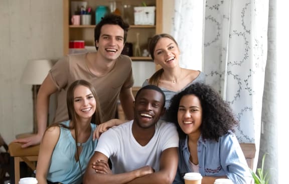 a group of people sitting around a table