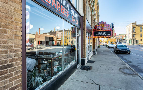 a barber shop with a sign in the window on a city street at Edge 35, Indianapolis, IN, 46203