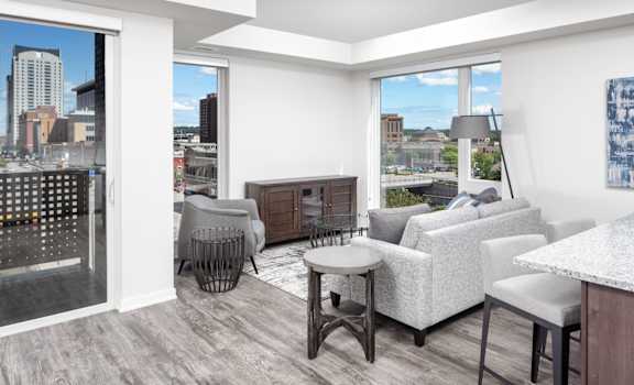 a living room with a view of the city at Maven on Broadway, Minnesota