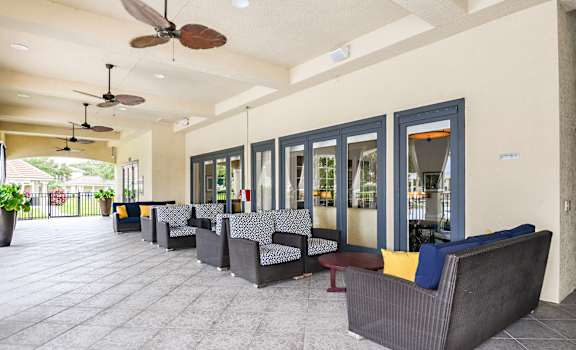 the lobbies at our apartments have seating areas with chairs and fans at Cypress Legends, Fort Myers, 33905