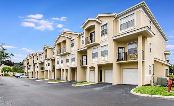 a street view of an apartment building with a red fire hydrant at Cypress Legends, Fort Myers, 33905