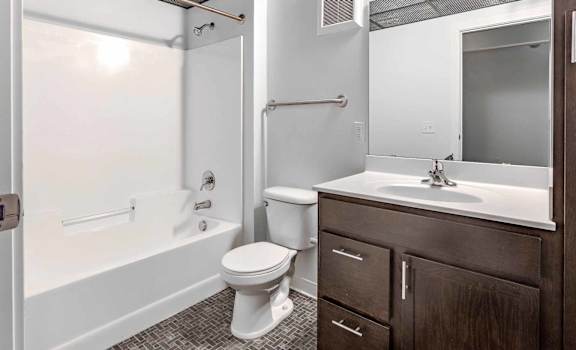 a bathroom with a sink toilet and a bath tub