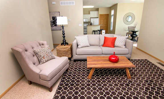 a living room with two couches and a coffee table