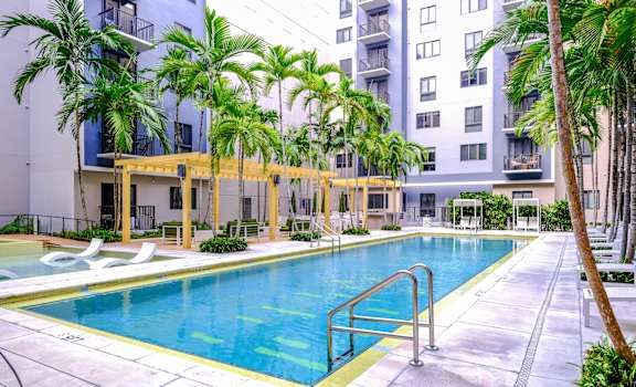resort-inspired swimming pool at Berkshire Coral Gables apartments
