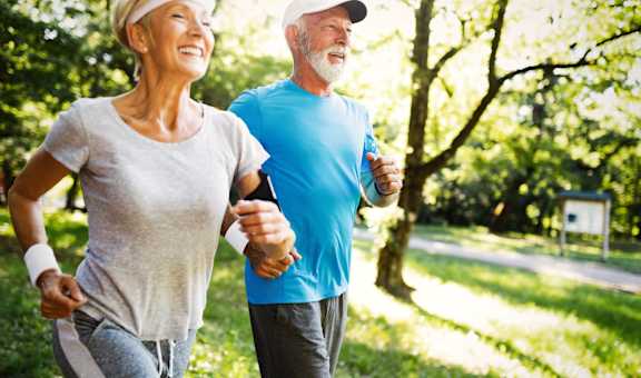 Man and Woman Jogging Outside at Hampton Apartments in Clearwater, FL 33759
