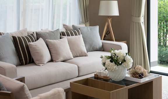 a living room with a white couch and a coffee table at The Palms, Charleston