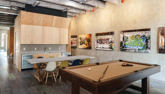 a game room with a pool table and a ping pong table  at Iron Works Sono, Norwalk, Connecticut