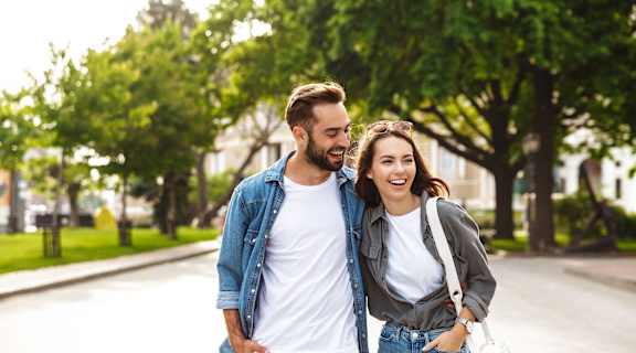 a man and a woman walking down a street