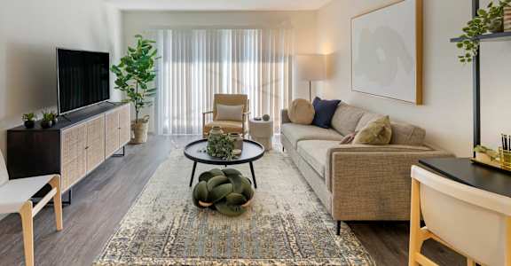 a living room with a couch and a tv