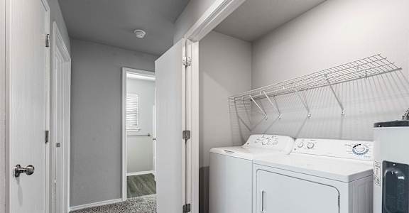 A laundry room with a washer and dryer.