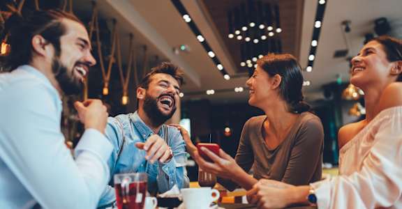 a group of people sitting at a table in a restaurant at The Ridge at Chenal Valley, Little Rock, Arkansas