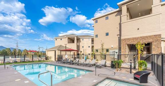Aura Flagstaff Apartments in Flagstaff, Arizona Pool with Lounge Chairs